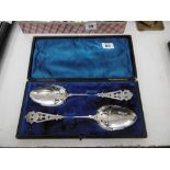 A boxed pair of silver plated berry spoons