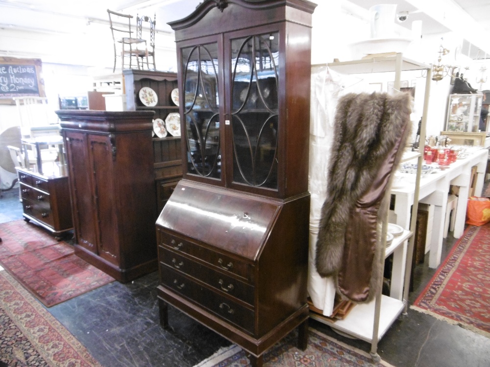 A mahogany bureau bookcase