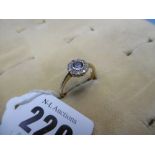 An Edwardian 18ct gold sapphire and diamond cluster ring size O