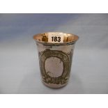 A white metal beaker marked 900 weight approximately 65 gram.