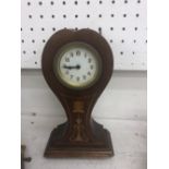 A small inlaid Edwardian mahogany tulip clock