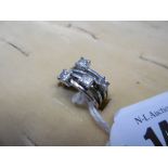 A white metal and diamond ring,