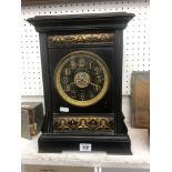 A 19th century black slate clock with brass inlaid plaques damaged Camerer Cuss and Co