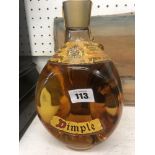 A bottle of Dimple " by appointment to Queen Mary"