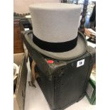 A boxed grey top hat size 7