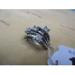 A white metal and diamond ring,