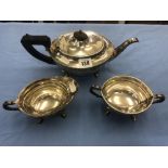 A Celtic design hallmarked silver three piece tea service Birmingham 1935