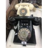 A vintage GPO black Bakelite model 328 with bell on and off buttons plus a cream Bakelite GPO