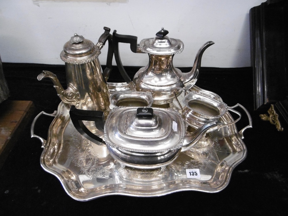 A four piece silver plated tea set on tray