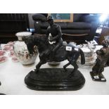 A bronze sculpture of a jockey and horse