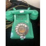 A vintage jade green Bakelite GPO model 332 telephone with exchange button