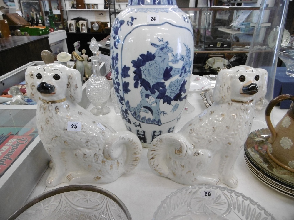 A pair of Staffordshire dogs with glass eyes