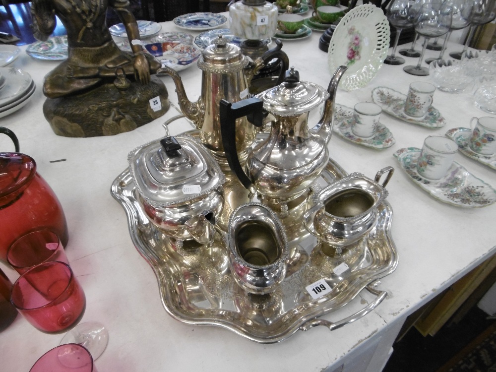 A four piece silver plated tea set on tray