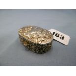 An Egyptian white metal pill box with pharaoh