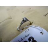 An 18ct gold diamond and solitaire ring with diamond shoulders,