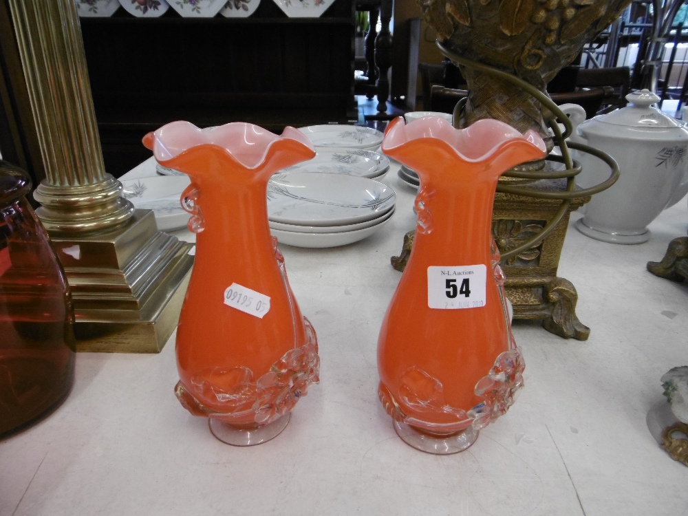 A pair of orange Murano glass vases