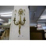 A brass two branch wall sconce