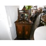 A 19th century rosewood corner cabinet