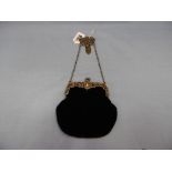 An evening bag with silver mounts