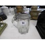 A pewter lidded tankard with hand painted porcelain plaque