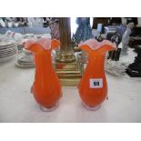 A pair of orange Murano glass vases