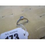 A platinum and diamond solitaire ring