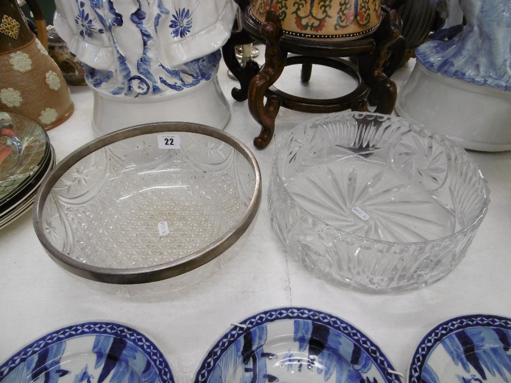 A cut crystal bowl with silver collar and one other