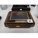 A vintage cigarette box with metal plaque of Naples
