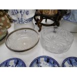 A cut crystal bowl with silver collar and one other