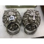 Two silvered bronze lions head door knockers