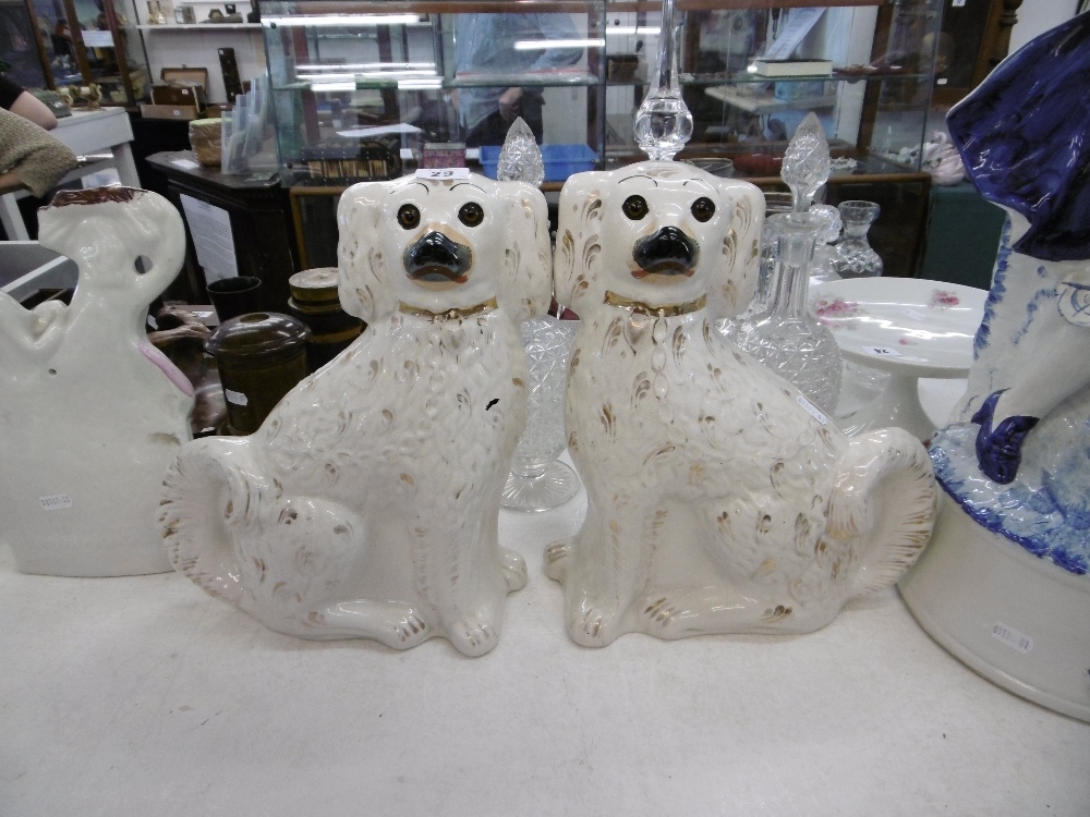 A pair of Staffordshire dogs with glass eyes