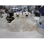 A pair of Staffordshire dogs with glass eyes