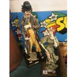 A figure of a clown and lady