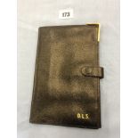 A leather wallet with 9ct gold edge, initialed D.