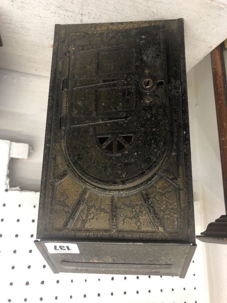 A vintage brass letter box