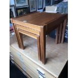 A mid century teak retro nest of three tables