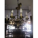 A gilt brass eight branch rococo style chandelier