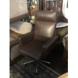 A leather swivel office chair