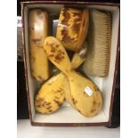 A ladies Bakelite dressing table set