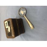 A small glass topped casket and a silver handled magnifying glass