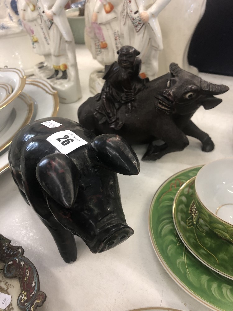 A carved wood pig a/f and a Chinese carved wood ox with figure