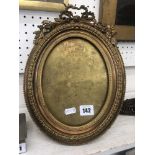 A French 19th centuy gilt brass oval frame