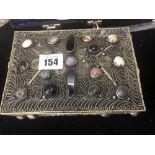 A gemstone set metal casket