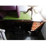 A mahogany kneehole desk on ball and claw feet 60 x 32 x 32 high