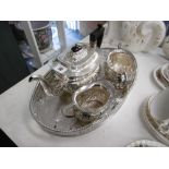 A three piece silver plated tea set with tray