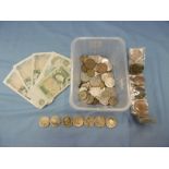 A box of assorted coins and bank notes