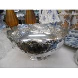 A large silver plated punch bowl with lion head handles