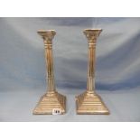 A pair of hallmarked silver candlesticks