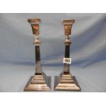 A pair of hallmarked silver candlesticks weight 567 grams