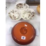 A decorative three division dish and a metal dish with cover